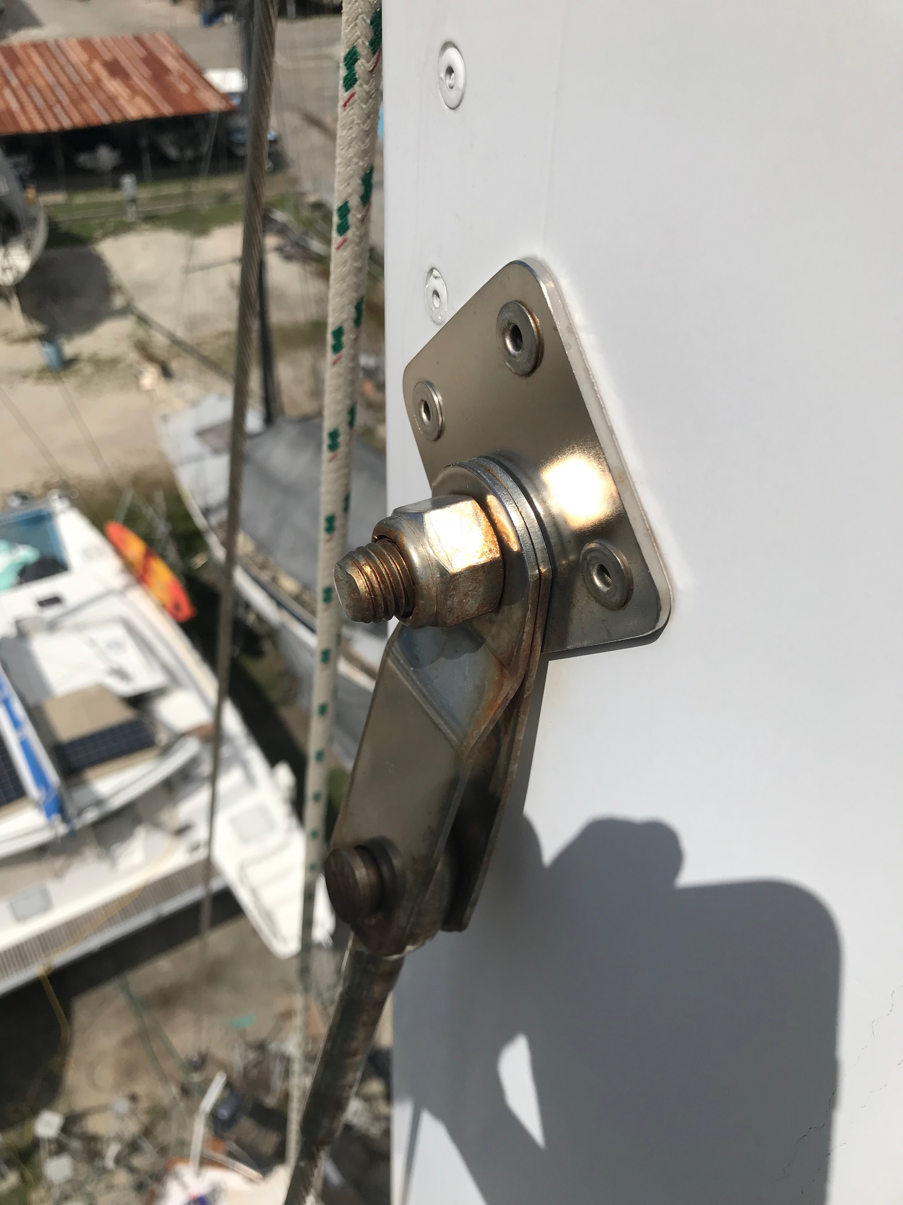 Standing rigging inspection showing stainless steel tangs with minor corrosion